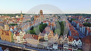 The old town of Gdansk architecture in sunset light. Aerial shot. Channel and buildings - top view