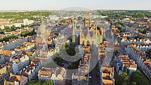 The old town of Gdansk architecture in sunset light. Aerial shot. Channel and buildings - top view