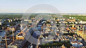 The old town of Gdansk architecture in sunset light. Aerial shot. Channel and buildings - top view