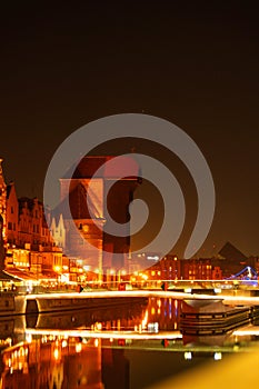 Old town in Gdansk at night. The riverside on Granary Island reflection in Moltawa River Cityscape at twilight. Ancient