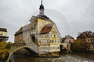 Old town hall or Altes Rathaus with two bridges over the Regnitz river at night in Bamberg, Bavaria, Franconia, Germany