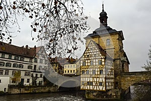 Old town hall or Altes Rathaus with two bridges over the Regnitz river at night in Bamberg, Bavaria, Franconia, Germany