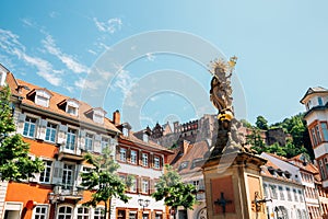 Old town Kornmarkt square and Heidelberg castle in Heidelberg, Germany