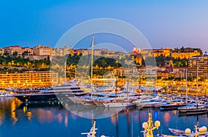 Old town of Monaco overlooking port Hercule during sunset