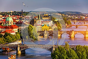 Old Town pier architecture and Charles Bridge over Vltava river in Prague with seagulls, Czech Republic. Prague iconic Charles