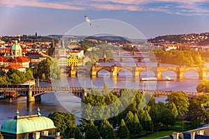 Old Town pier architecture and Charles Bridge over Vltava river in Prague with seagulls, Czech Republic. Prague iconic Charles