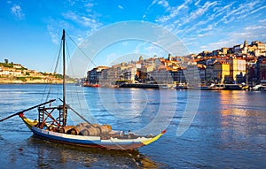 Old town of Porto Portugal. Antique boat with port wine