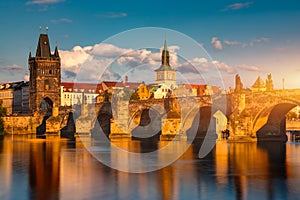 Old town of Prague. Czech Republic over river Vltava with Charles Bridge on skyline. Prague panorama landscape view with red roofs