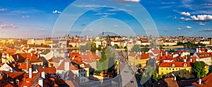 Old town of Prague. Czech Republic over river Vltava with Charles Bridge on skyline. Prague panorama landscape view with red roofs