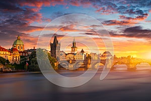 Old town of Prague. Czech Republic over river Vltava with Charles Bridge on skyline. Prague panorama landscape view with red roofs