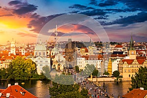 Old town of Prague. Czech Republic over river Vltava with Charles Bridge on skyline. Prague panorama landscape view with red roofs