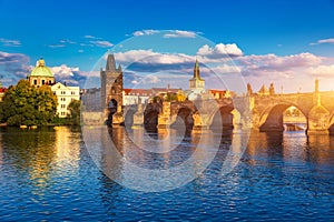 Old town of Prague. Czech Republic over river Vltava with Charles Bridge on skyline. Prague panorama landscape view with red roofs