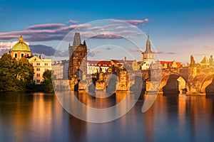 Old town of Prague. Czech Republic over river Vltava with Charles Bridge on skyline. Prague panorama landscape view with red roofs