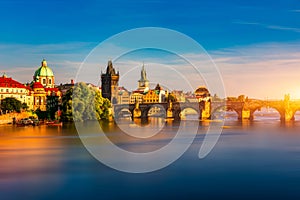 Old town of Prague. Czech Republic over river Vltava with Charles Bridge on skyline. Prague panorama landscape view with red roofs