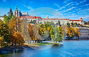 Old town of Prague, Czech Republic over river Vltava with Saint Vitus cathedral on skyline. Bright sunny day blue sky. Praha