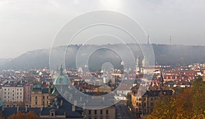 Old Town of Prague with remnants of morning fog in autumn.