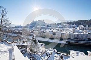 Old town of Salzburg with Fortress Hohensalzburg, Austria covered by snow