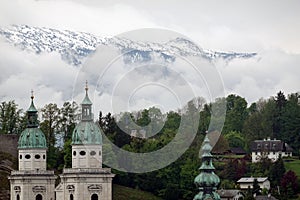 Old town of Salzburg view before high Alps mountains