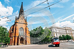 Old town street, The Church of Jan Amos Comenius Red Church and tram in Brno, Czech Republic