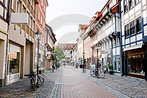 Old town street in Goettingen, Lower Saxony, Germany. Numerous shops.