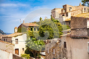 Old town of Tossa de mar. Medieval buildings next to the castle. City and old fortifications. Narrow streets and monuments in the