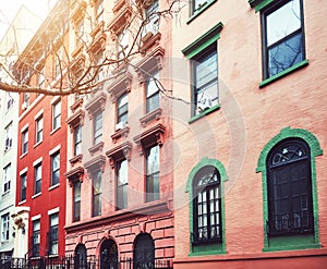 Old townhouses in Manhattan, color toning applied, New York, USA