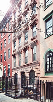 Old townhouses in Manhattan, color toning applied, New York, USA