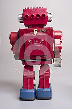 Old toy from the 1950s of a lonely and paradi robot made of red tin, battery operated,