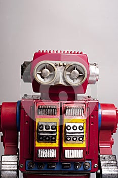 Old toy from the 1950s of a lonely and paradi robot made of red tin, battery operated