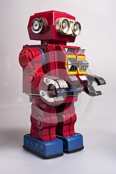 Old toy from the 1950s of a lonely and paradi robot made of red tin, battery operatedapan