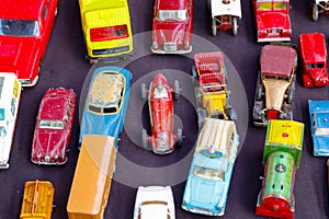 Old toy cars displayed at a junk shop