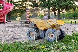 Old toy truck abandoned in the park playground