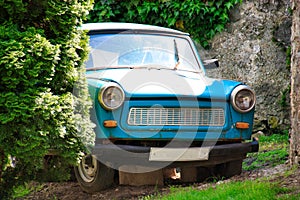 An old trabant was parked on stones