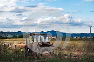 Old tractor on an agricultural field