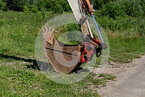 Old tractor bucket on the grass