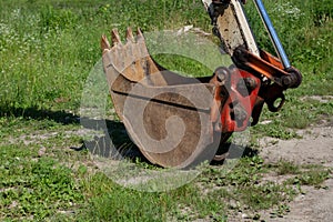 Old tractor bucket on the grass