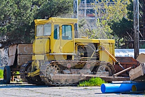 Old tractor bulldozer at plant
