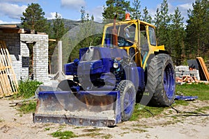 Old tractor on a construction site