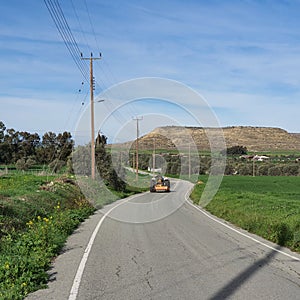 An old tractor on a country road of Athienou town in Cyprus Island