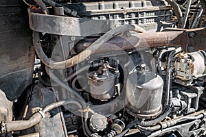 Old tractor engine close-up. Worn out engine in full frame. Background