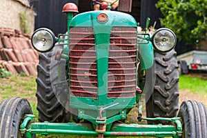 Old tractor on a farm as a work tool