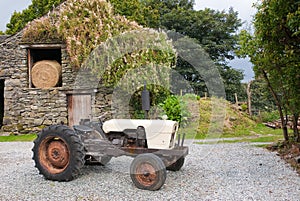 Old tractor in farmyard