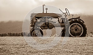 Old Tractor on the Hill Sepia Tone photo