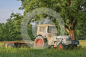 Old tractor on a meadow