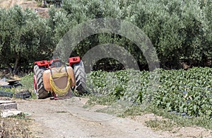 Old tractor parked near the field in the countryside