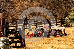 Old Tractor Parked outside a Corral In Winter In Arizona