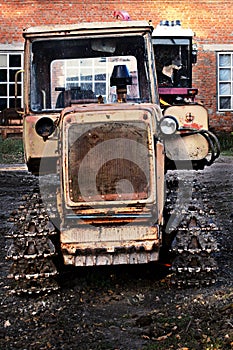 Old tractor on tracks - in the yard