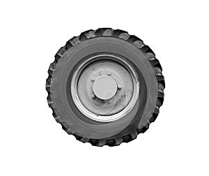 Old tractor or truck wheel isolated on a white background.