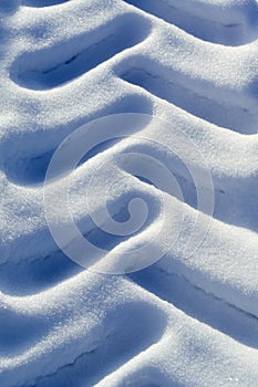 Old tractor tyre marks in snow