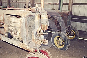 Old tractors in a barn